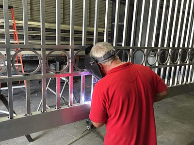 Mike Pelham fabricating a gate in our shop. Mike was a certified welder with the gas company and brought the same quality and dedication to all his gates. 